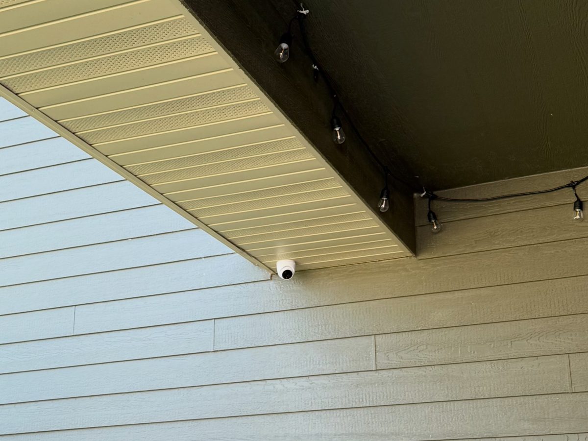 Dome camera mounted under a deck overhang on a Sioux Falls home