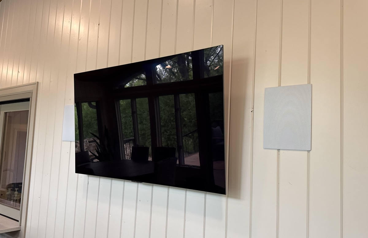 Wall-mounted TV with in-wall speakers